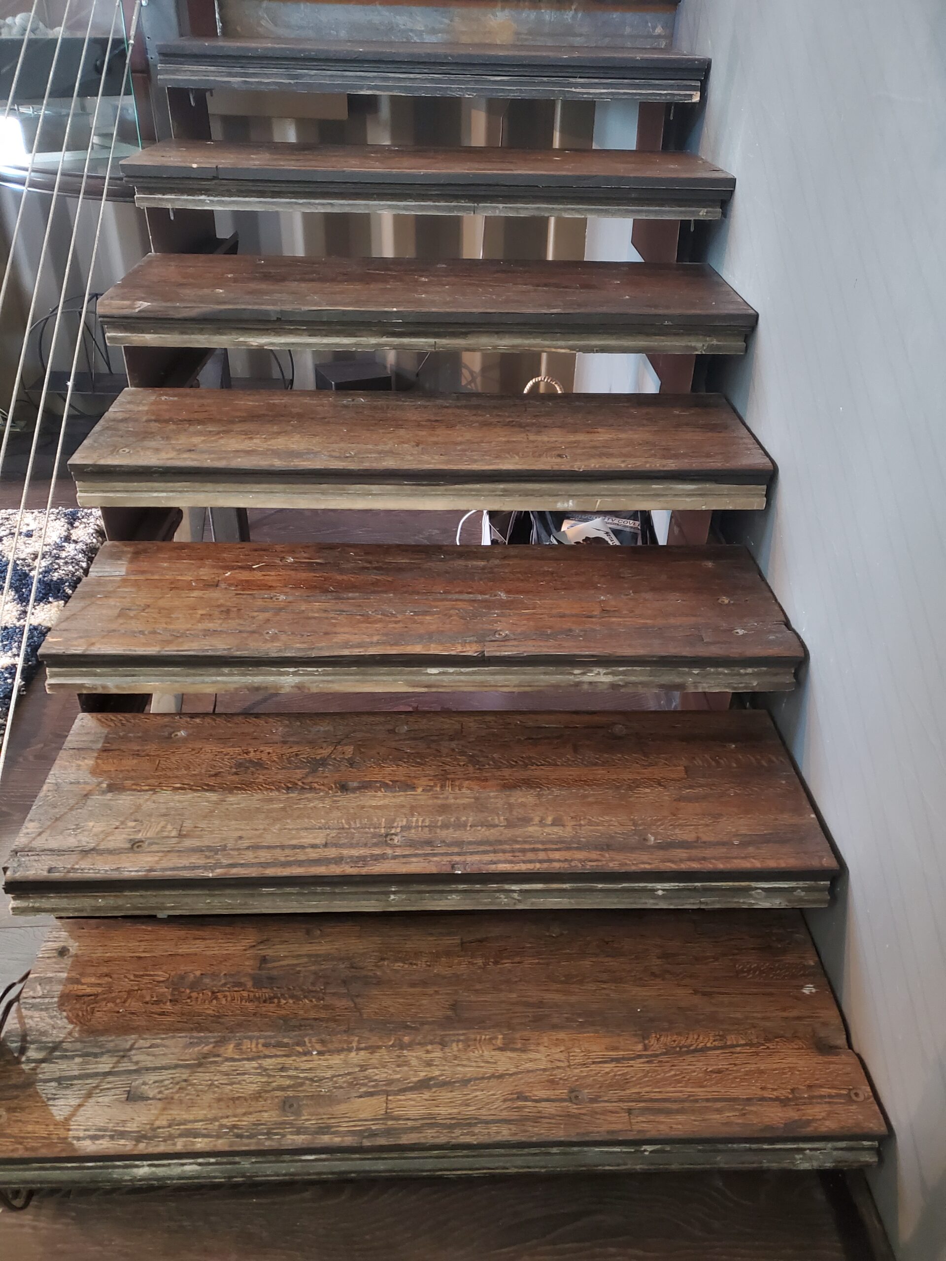 A staircase built from weathered steel and reclaimed wood.